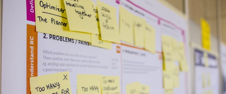 Close up of a customer journey planning board with post-it notes